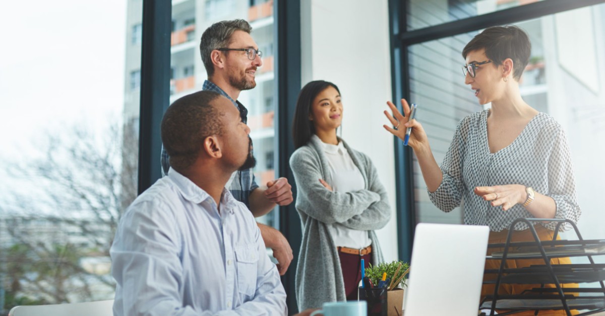 People around a computer strategising