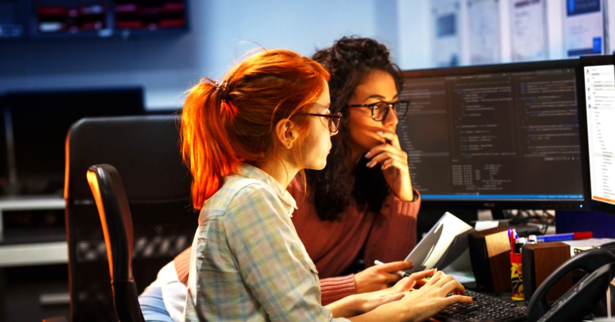 Two women coding